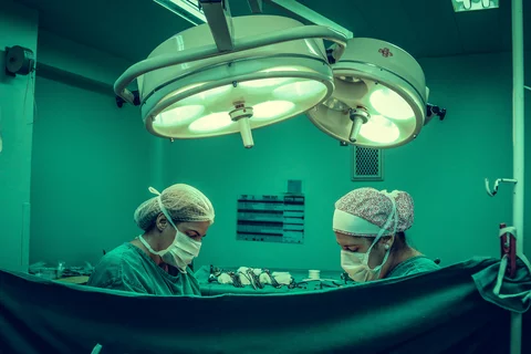 two surgeons in an operating room 